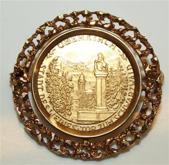 Mounted gold coin